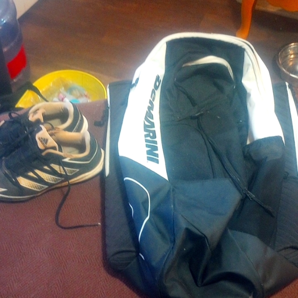 Baseball backpack and a pair of cleats size3  black and white
